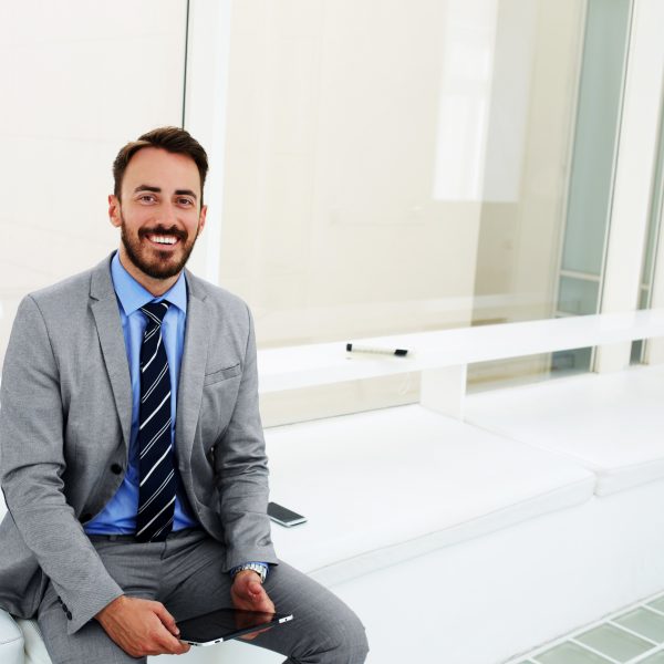 young businessman smiling employee engagement realized worth