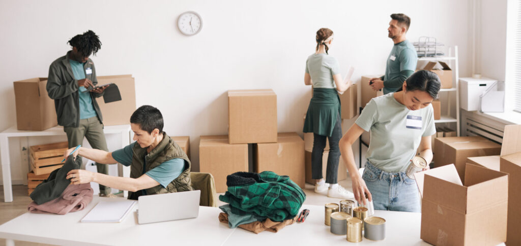 Diverse Group of People Volunteering at Charity and Donations Event
