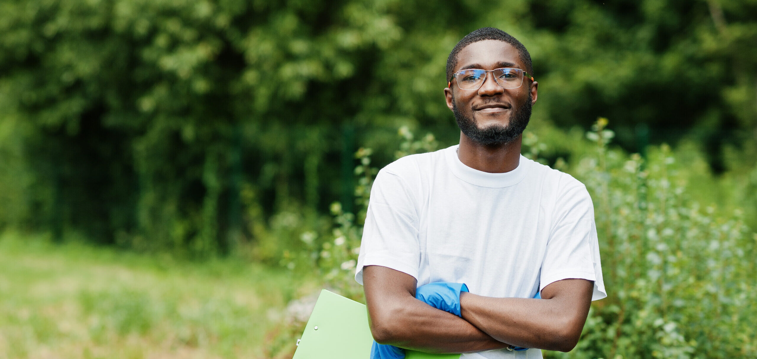 Black Male Volunteer with Clipboard in Park