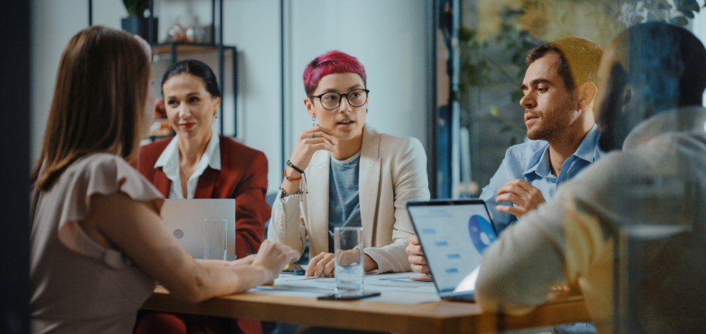 Team of business professionals meeting in an office conference room