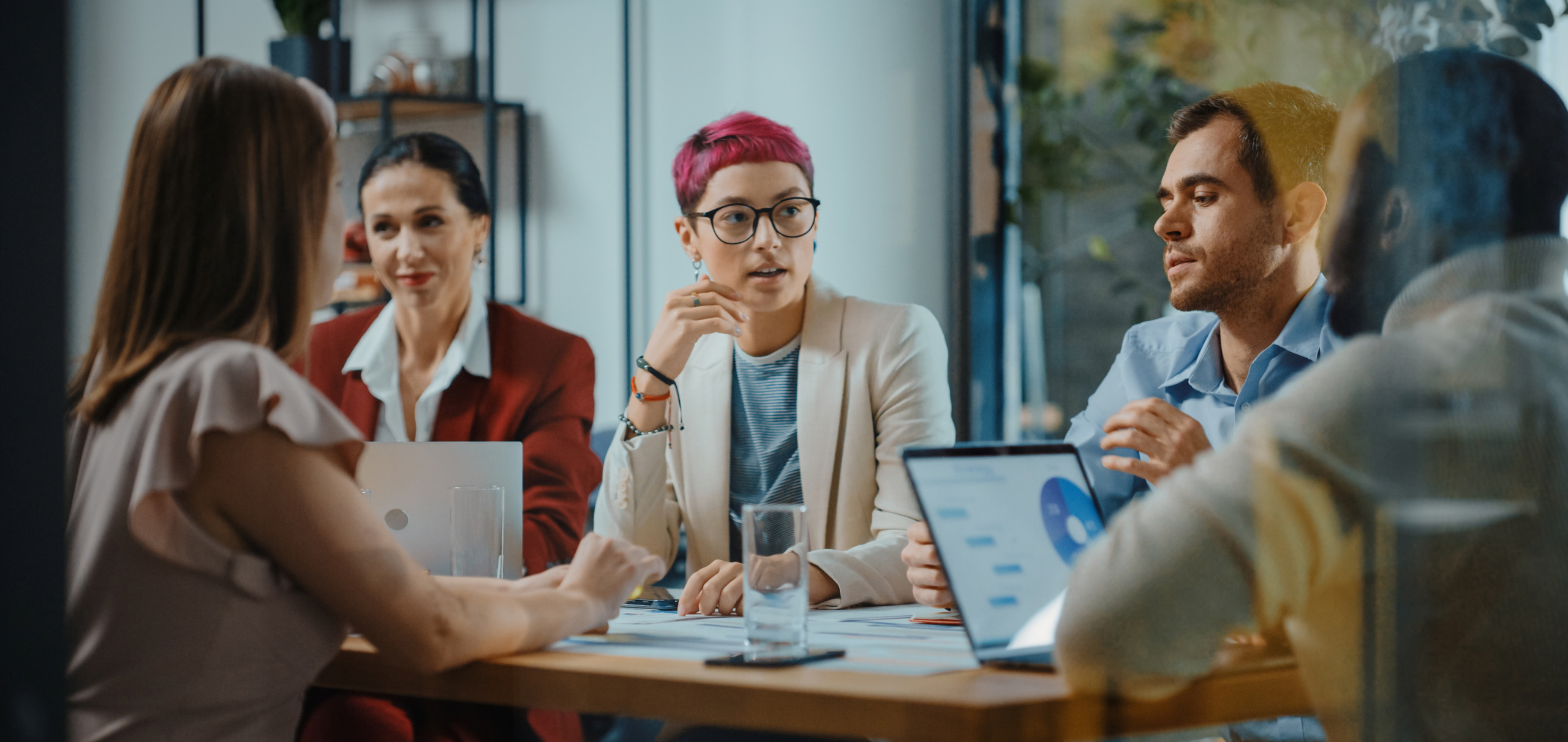 Team of business professionals meeting in an office conference room